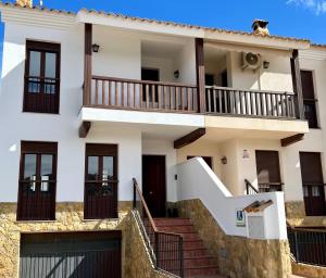 ein großes weißes Haus mit Treppe davor in der Unterkunft Casa Pueblo Overlooking the Village of Lubrín! in Lubrín