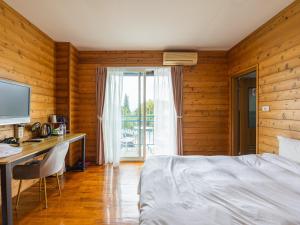 Postel nebo postele na pokoji v ubytování Bishui Shanju Lakeside B&B