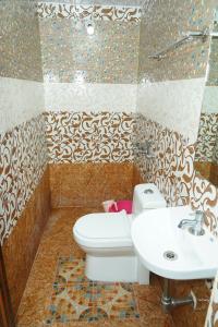 Vonios kambarys apgyvendinimo įstaigoje Royal Coorg Guest house