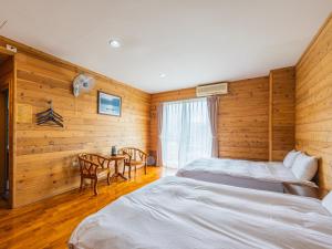 Postel nebo postele na pokoji v ubytování Bishui Shanju Lakeside B&B