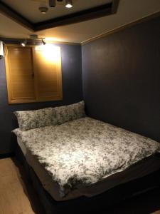 Ένα ή περισσότερα κρεβάτια σε δωμάτιο στο G Mini Hotel Dongdaemun