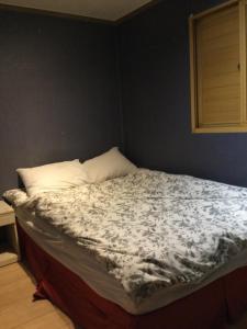 Ένα ή περισσότερα κρεβάτια σε δωμάτιο στο G Mini Hotel Dongdaemun
