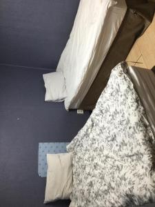 Ένα ή περισσότερα κρεβάτια σε δωμάτιο στο G Mini Hotel Dongdaemun