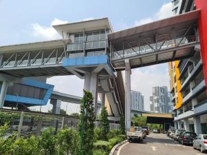 an elevated walkway over a street in a city at Alpine Parkland Netflix 5 beds at MRT Batu 11 Cheras in Cheras