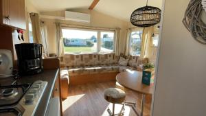 a kitchen and living room of a tiny house at Duindoorn 45 in IJmuiden