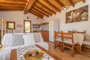 a living room with a couch and a table at Es Coll den Pastor in Sóller