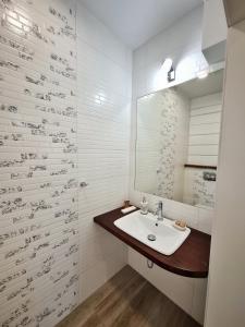 a bathroom with a sink and a mirror at W dolinie Sanu in Lesko