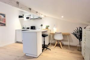 Kuchyň nebo kuchyňský kout v ubytování Nid douillet - Hypercentre - Gare - Métro - Wifi