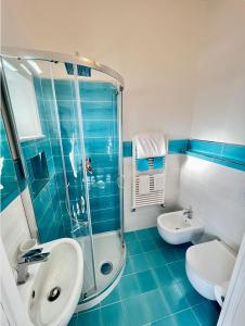 a bathroom with a shower and a sink and a toilet at Villa Egidio in Ischia