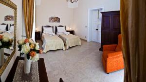 Postel nebo postele na pokoji v ubytování Palazzo Volta Boutique Luxury B&B + 37 fotografií