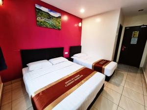 Postel nebo postele na pokoji v ubytování Hotel Sun Birds