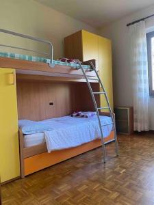 a bedroom with two bunk beds in a room at Villa Rosa Perla - Lake Como - Schignano in Schignano
