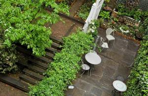an overhead view of a garden with chairs and plants at Chelsea Pines Inn in New York