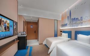 Katil atau katil-katil dalam bilik di Hampton by Hilton Shenzhen Yuanshan