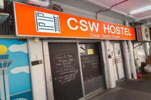 a csw hospital with a sign above the doors at CSW Hostel in Singapore