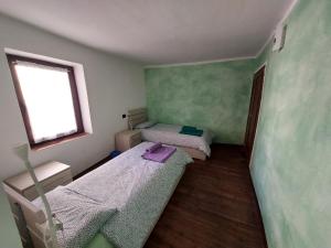 Postel nebo postele na pokoji v ubytování Gran Paradiso