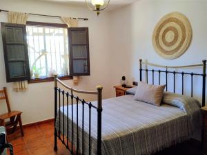 Postel nebo postele na pokoji v ubytování La Casita de Piedra