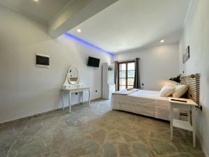 A bed or beds in a room at Barbara house