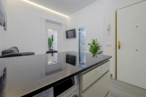 Telewizja i/lub zestaw kina domowego w obiekcie SUARA Apartamentos 2