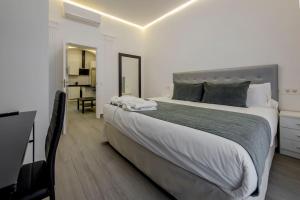 Łóżko lub łóżka w pokoju w obiekcie SUARA Apartamentos 2