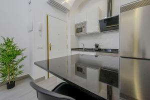 Kuchnia lub aneks kuchenny w obiekcie SUARA Apartamentos 2