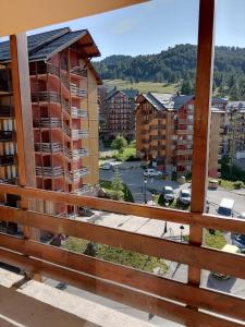 a view of a city from a balcony at RisoulSki Constellation in Risoul