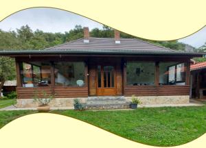 a picture of a house with a magnifying glass at Hámori Álom in Miskolc