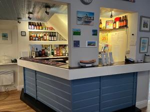 a blue and white counter top in a restaurant at Awel Mor in Criccieth