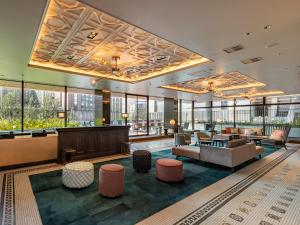 a hotel lobby with a waiting area and furniture at GINZA HOTEL by GRANBELL in Tokyo