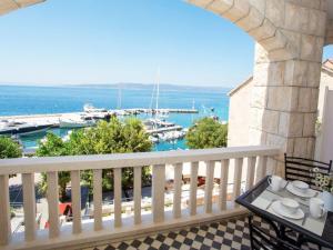 a balcony with a view of a marina at Apartments & Room Vesna in Brela