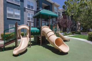 a playground with a slide in front of a building at Sunnyvale 1BR w Pool WD Gym nr 101 SFO-1049 in Sunnyvale