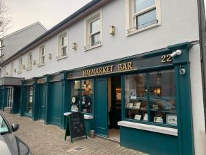 ahmara harmarket bar on the side of a building at Moy Hotel in Mayo