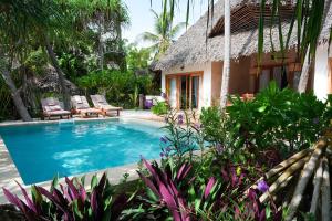 a villa with a swimming pool and a resort at Villa Tulia in Matemwe +62 photos