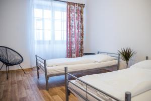 Postel nebo postele na pokoji v ubytování Hostel Little Quarter