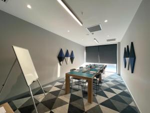 a dining room with a long table and chairs at Holiday Inn Express - Ankara - Airport by IHG in Ankara