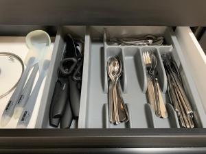 a drawer filled with utensils and silverware at Apartment 70 qm Kalimandscharo 3 in Zielitz - Magdeburg in Zielitz