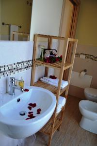 a bathroom with a sink and a toilet at B&B Vivere il Mare in San Vito lo Capo