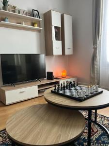 Televízia a/alebo spoločenská miestnosť v ubytovaní KB 18 Métro 14 et 7 - Free Parking