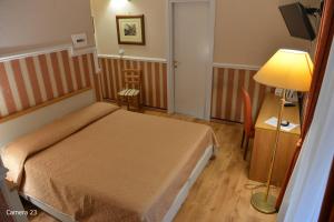 Posteľ alebo postele v izbe v ubytovaní Catania Centro Rooms