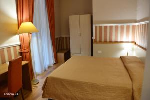 Posteľ alebo postele v izbe v ubytovaní Catania Centro Rooms