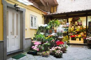 a flower shop with flowers in front of it at Casa Tonia San Cesareo in Sorrento