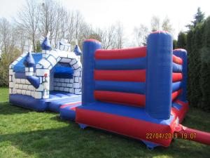 a set of inflatable bouncers in the grass at 100SaulesVikingi in Grobiņa