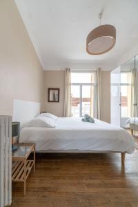 Posteľ alebo postele v izbe v ubytovaní Le larbaud - Appartement calme et lumineux en centre ville