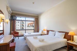 Postel nebo postele na pokoji v ubytování Villa Fatima Hotel by Umbral + 5 fotografií