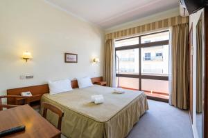 Postel nebo postele na pokoji v ubytování Villa Fatima Hotel by Umbral