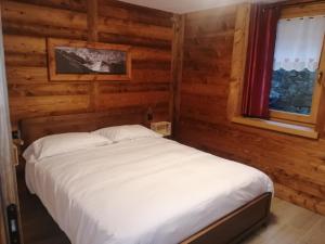 Postel nebo postele na pokoji v ubytování Appartamenti Lucianaz