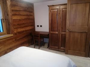 Postel nebo postele na pokoji v ubytování Appartamenti Lucianaz