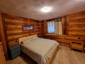 Postel nebo postele na pokoji v ubytování Appartamenti Lucianaz