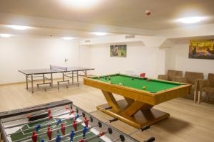 a room with a pool table and ping pong balls at Askana in Białka Tatrzańska