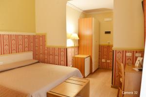 Posteľ alebo postele v izbe v ubytovaní Catania Centro Rooms
